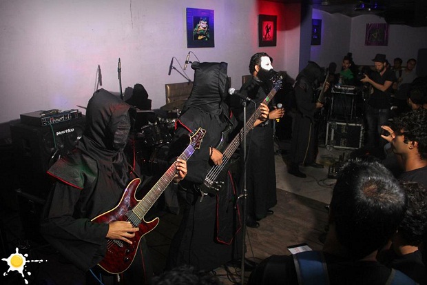 The hooded members of Reptilian Death with vocalist Vinay Venkatesh