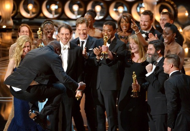The cast and crew of "12 Years A Slave" accepting the Oscar for Best Motion Picture